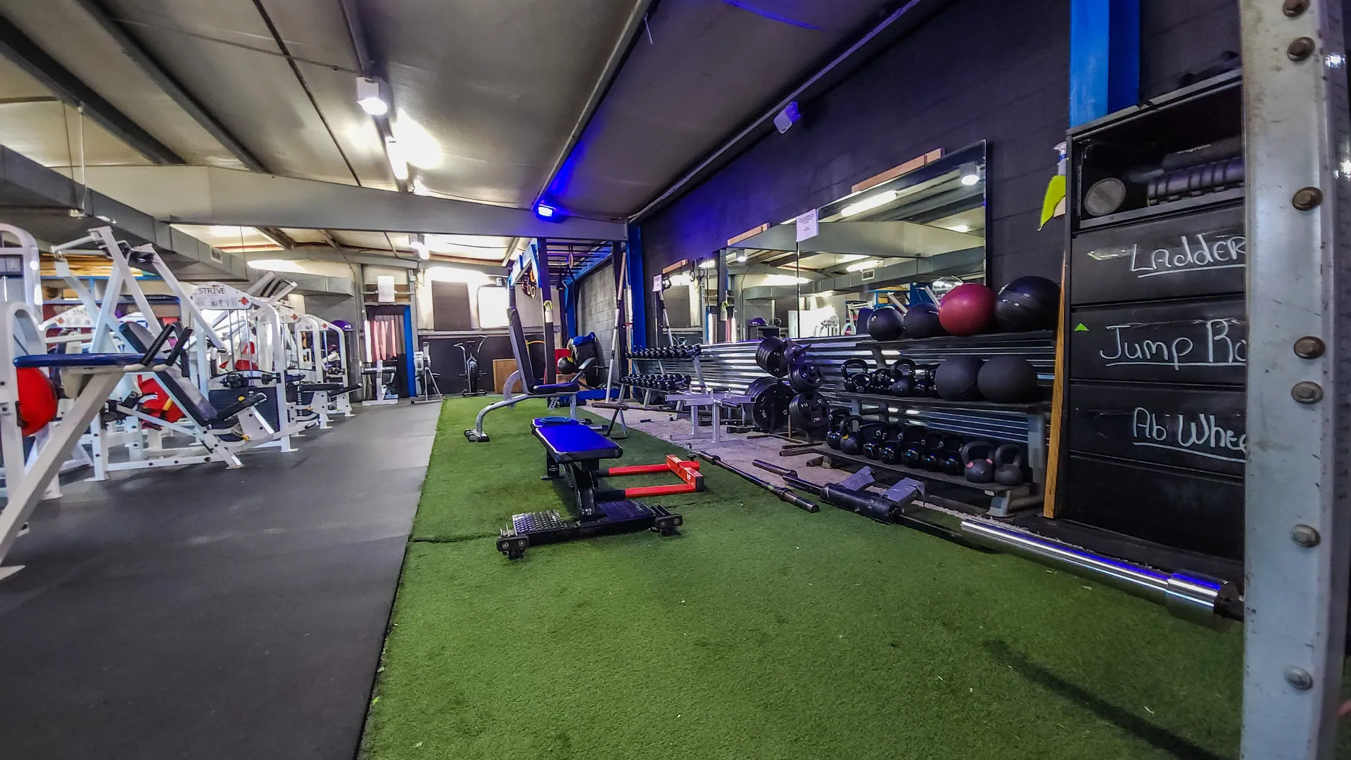 Free weights and the turf training lane at The Rock